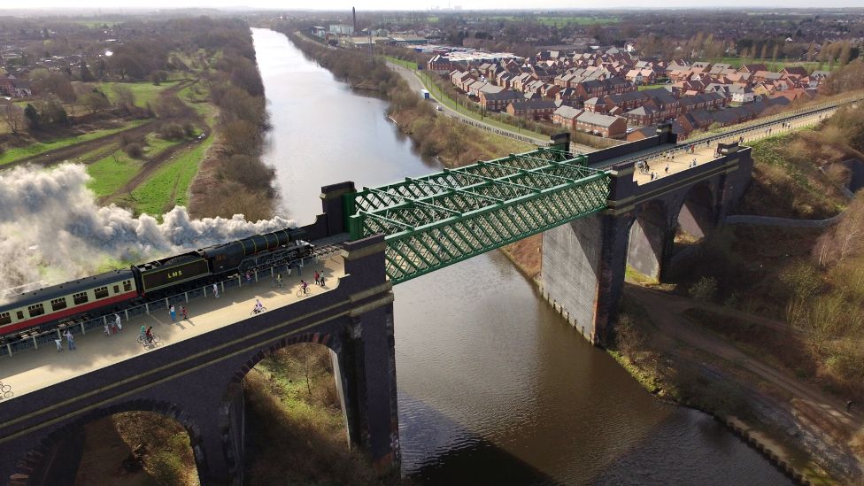 A CGI image of the proposed cycle and walk path alongside a train on the Cadishead viaduct