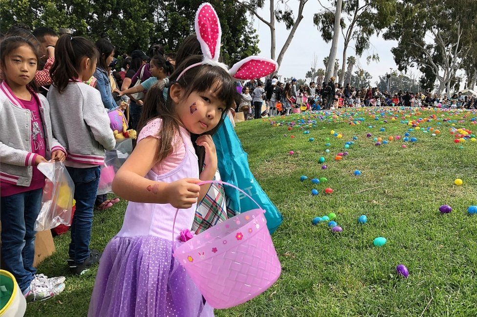 Children prepare for a huge Easter egg hunt at Connection Point Church's sixth annual "Eggstravaganza" in Torrance, California