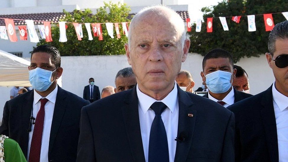 Tunisia's President Kais Saied and his wife Ichraf Chebil walk outside a polling station, during a referendum on a new constitution in Tunis, Tunisia July 25, 2022