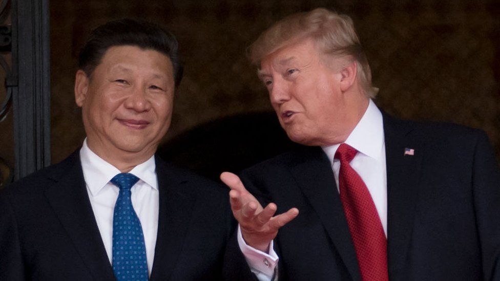 US President Donald Trump (R) welcomes Chinese President Xi Jinping (L) to the Mar-a-Lago estate in West Palm Beach, Florida.