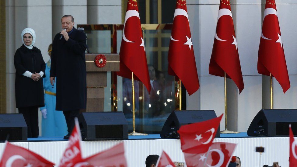 Turkish President Tayyip Erdogan with his wife Emine addresses supporters in Ankara