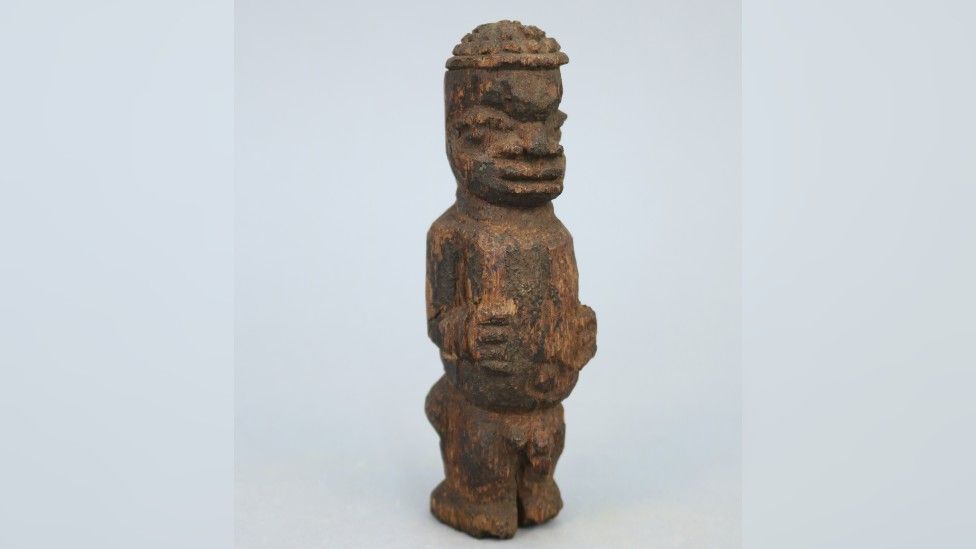 Small carved wooden male figure, listed as originating from the ‘Benin West Africa Expedition 1897’.