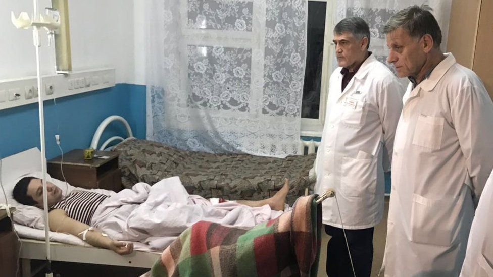 Doctors examine the wounded man in the hospital after shooting near the church in Kizlyar Dagestan, Russia, 18 February 2018.