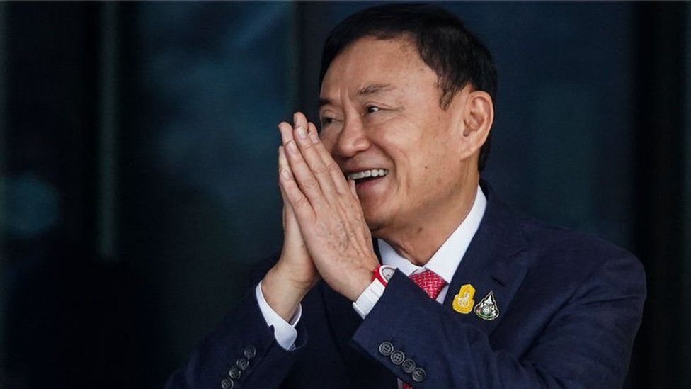 Former Thai prime minister Thaksin Shinawatra greets supporters and journalists upon his arrival at Don Mueang airport in Bangkok, Thailand, 22 August 2023.