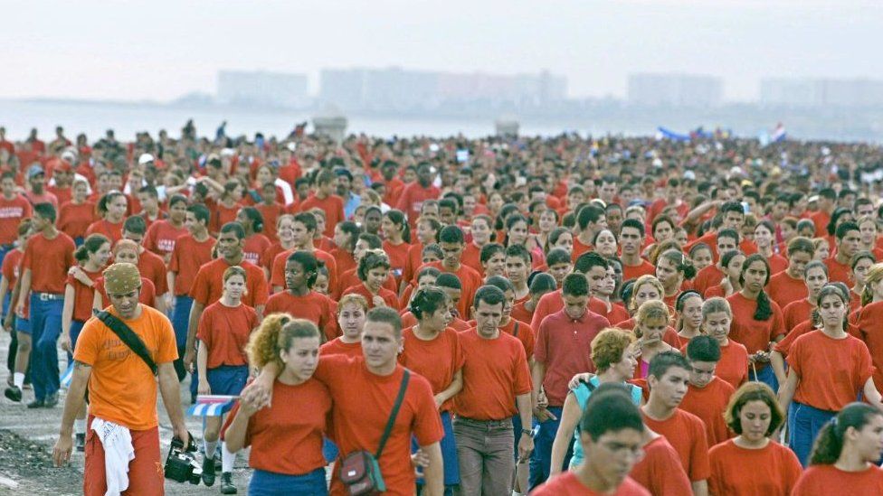 Thousands of young Cubans march in the Malecon coastal boulevard in Habana, to protest against the United States foreign policy towards Cuba and to show their support for Socialism, 12 June 2002.