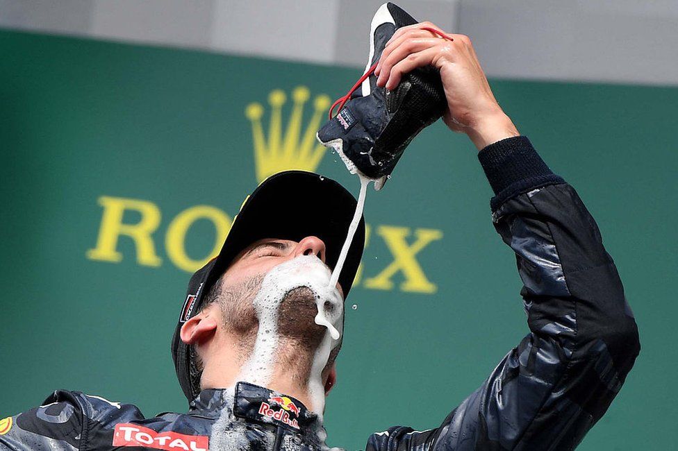 F1 driver Daniel Riccardio celebrating in his signature style