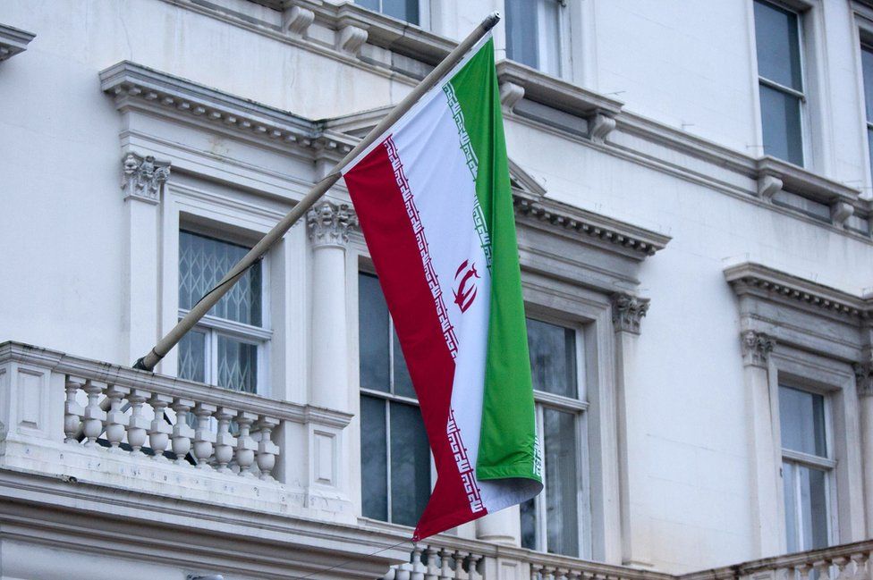 A picture of Iran's flag hanging from the Iranian Embassy in central London