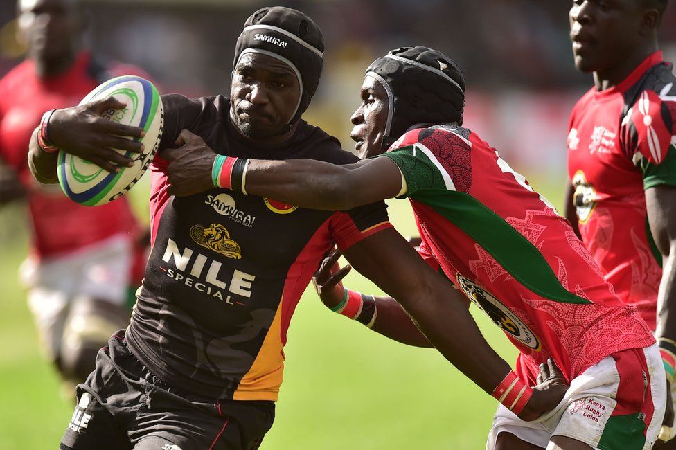 Uganda Cranes' Michel Okorach (L) attempts to fend off Kenya's Vincent Mose in a rugby match in Nairobi, Kenya - Saturday 7 July 2018