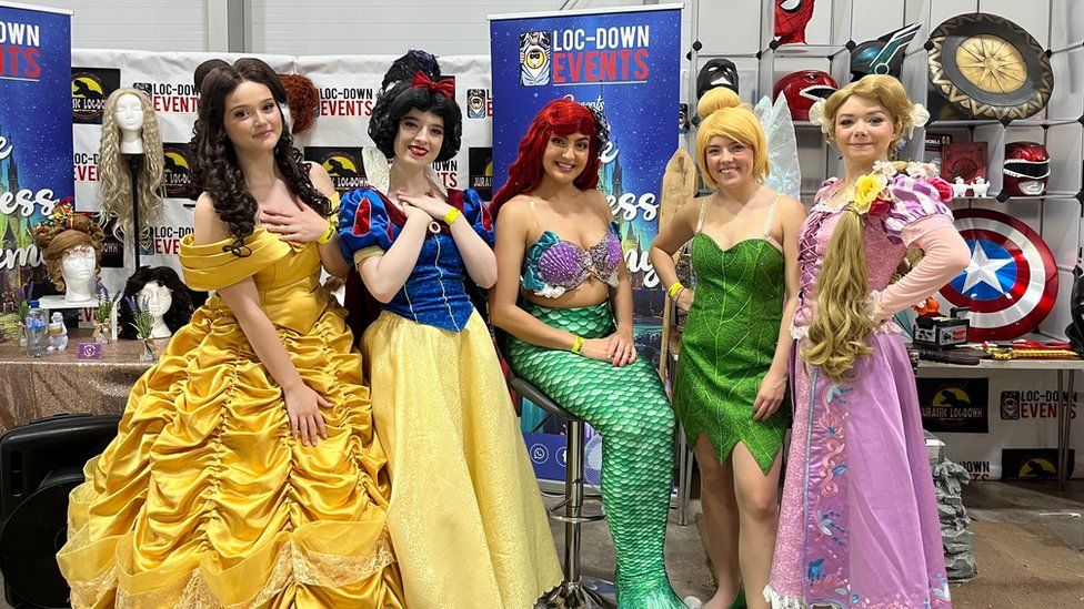 Cosplayers as Belle, Snow White, Ariel, Tinkerbell and Rapunzle