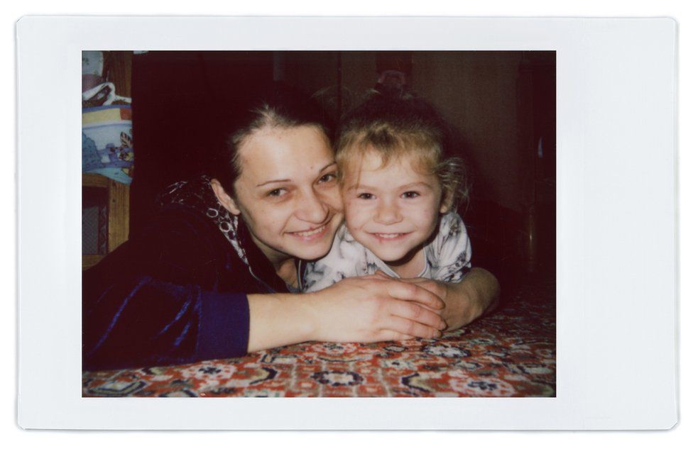 A polaroid photo of Ana and her daughter