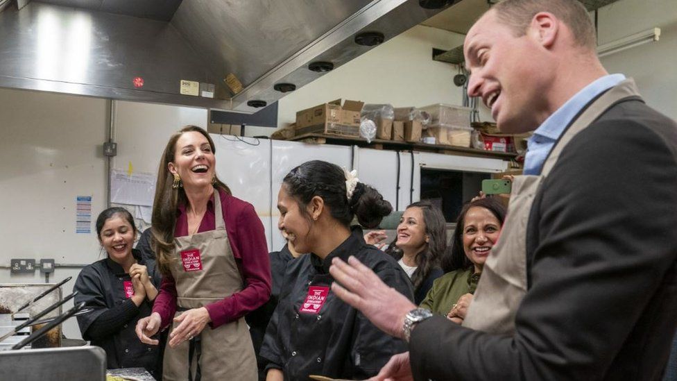 Princess and Prince of Wales in the kitchen of the Indian Streatery