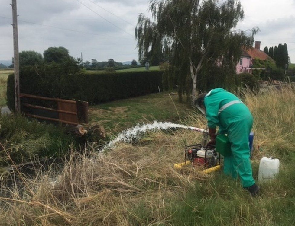 Environment Agency staff working to deal with the pollution