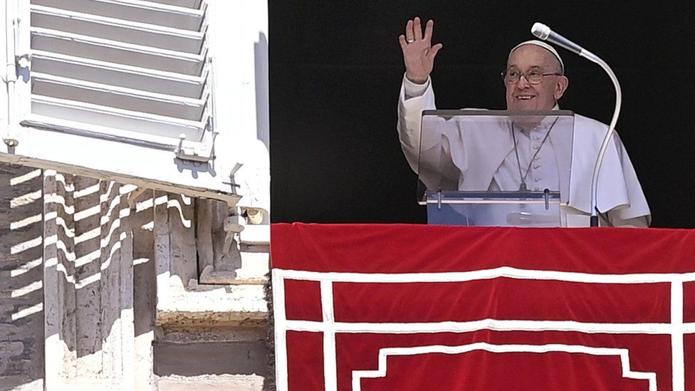 Pope Francis waving