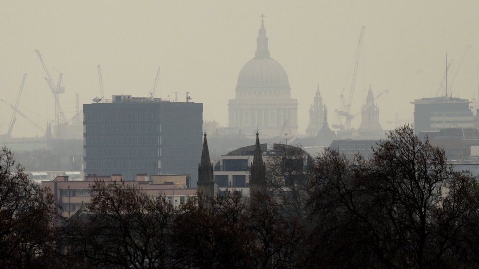Pollution over London city skyline showing St Paul's Cathedral, seen from Primrose Hill