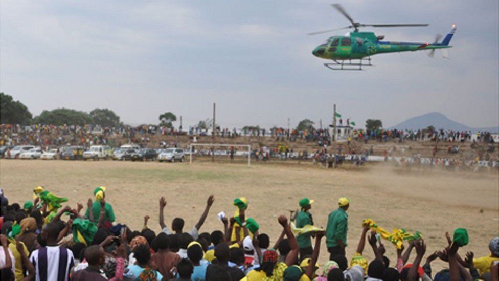 A CCM helicopter lands at a campaign rally in Tanzania