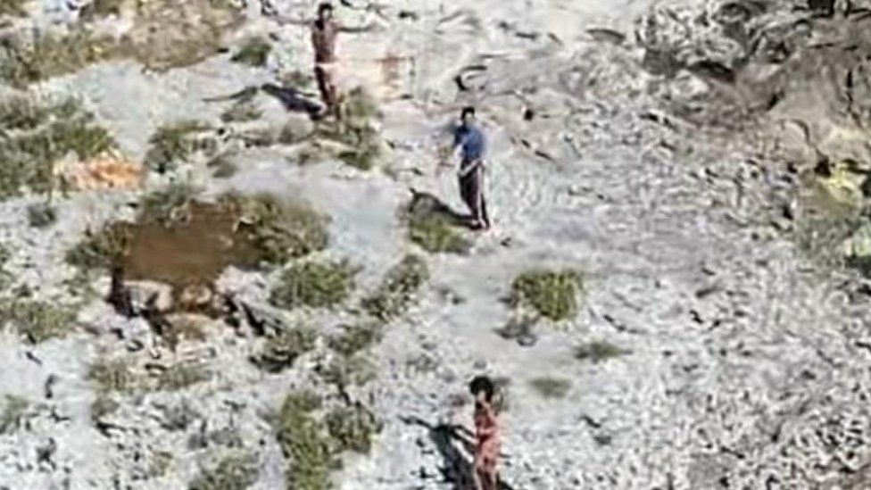 Three people stranded on Anguilla Cay, Bahamas, 8 February 2021.