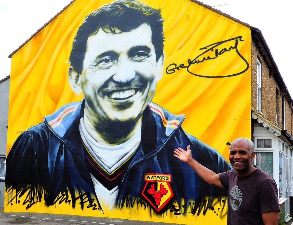 Luther Blissett by a mural to Graham Taylor