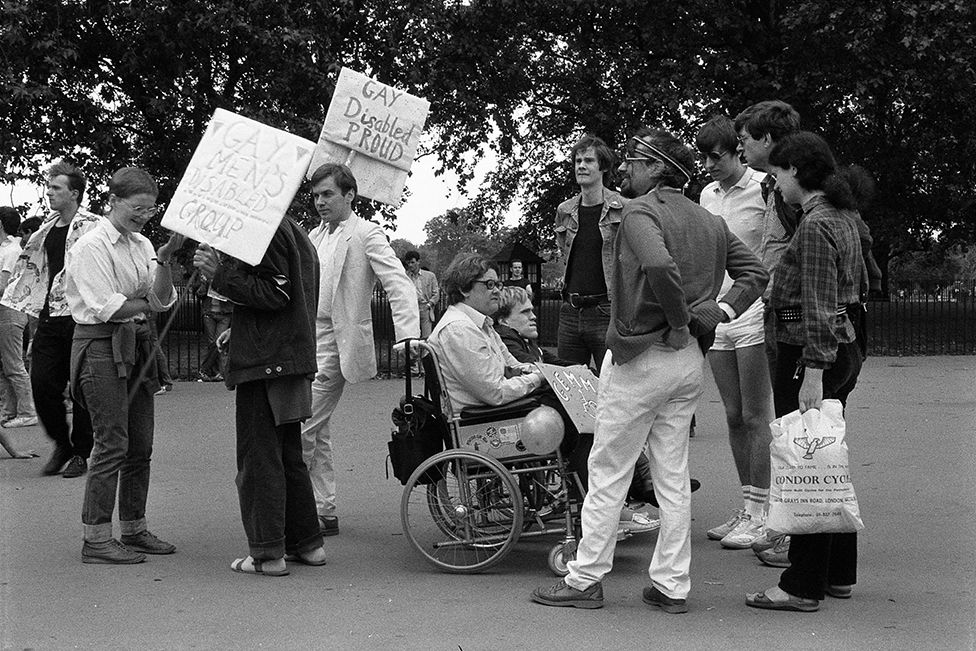 People attend the Pride march in 1983