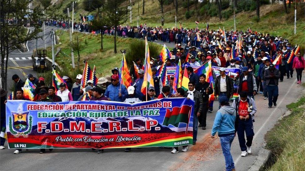 Supporters of Evo Morales march during a protest from El Alto to La Paz on November 13, 2019