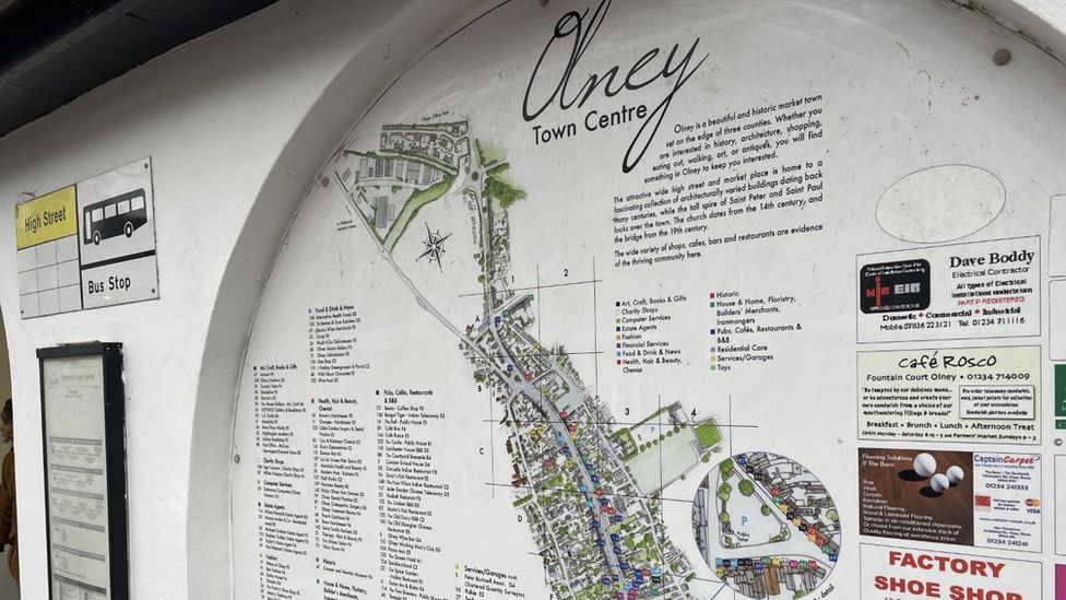 The bus shelter in Olney, showing a map of the town centre