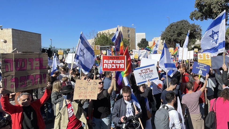 People protest against Israel's new government outside the Knesset in Jerusalem on 29 December 2022