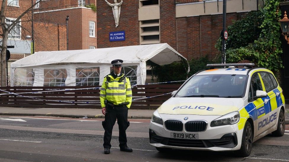 Police officer outside church