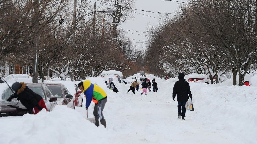 Residents of Buffalo clear snow