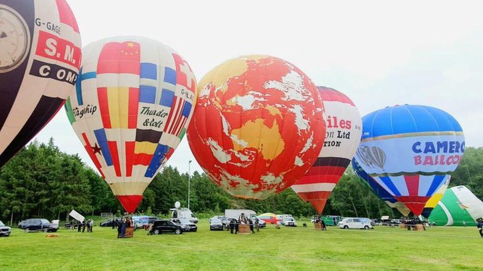 BBC1 ident balloon alongside other balloons at Midlands Air Festival