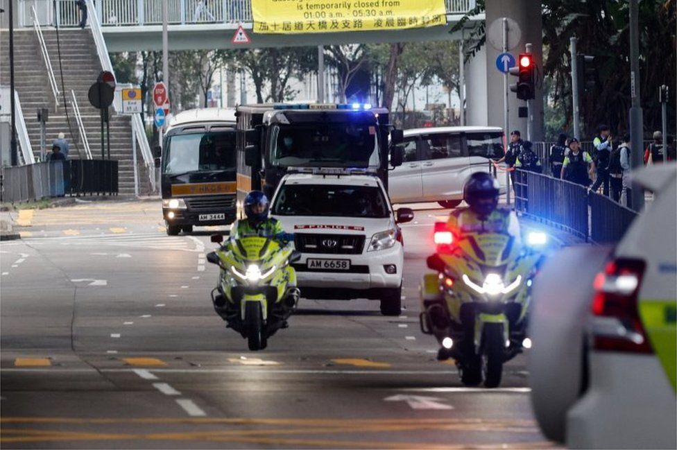 A motorcade carries media mogul Jimmy Lai, founder of Apple Daily, back to Lai Chi Kok Reception Centre after the first day of his national security trial in Hong Kong, China December 18, 2023.