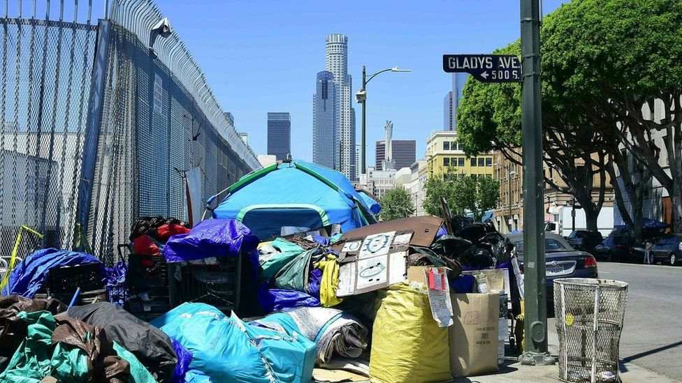 Tents housing the homeless and their belongings crowd a street corner in Los Angeles, California on April 20, 2017