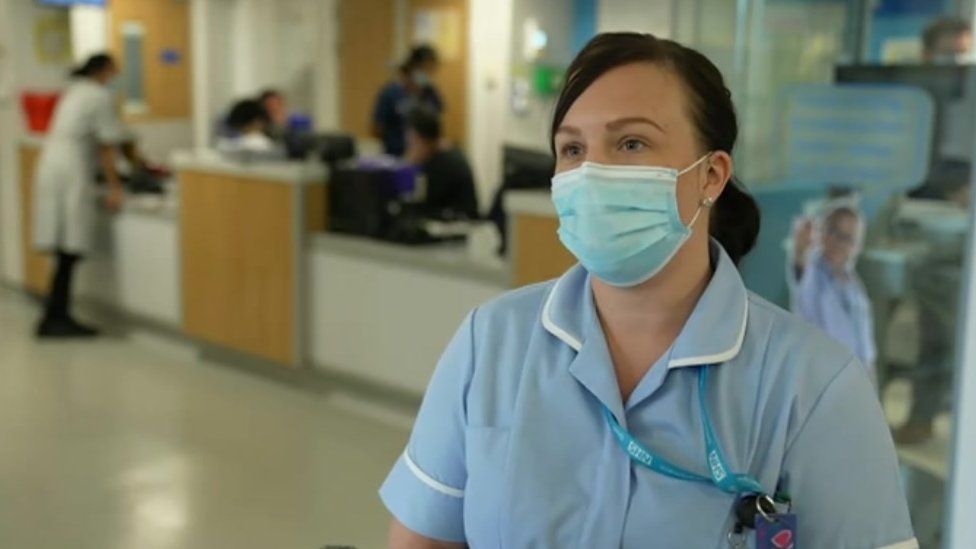 A nurse wearing a face-mask