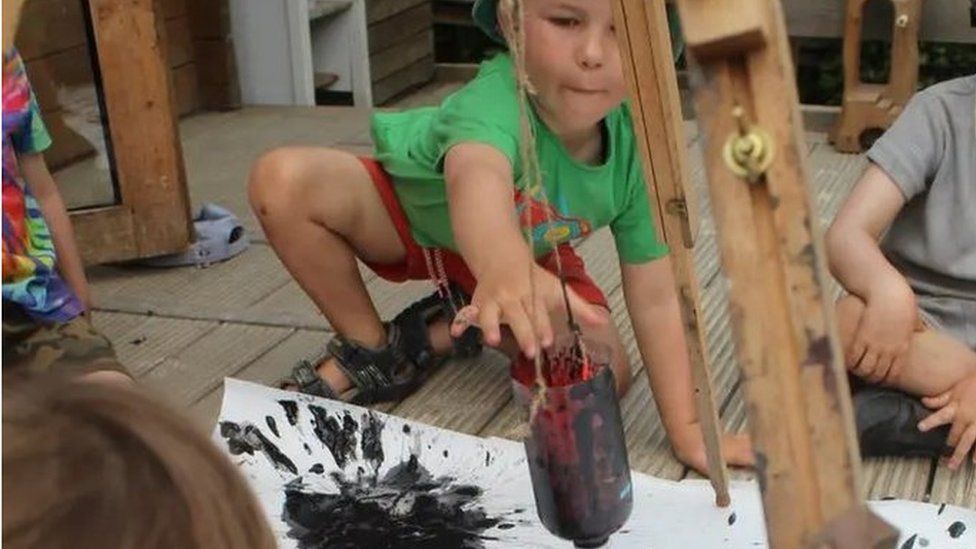 A child playing with paint