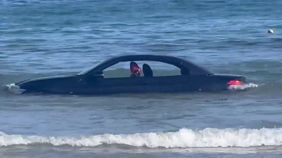 Car in sea at Trevaunance Cove St Agnes BBC News