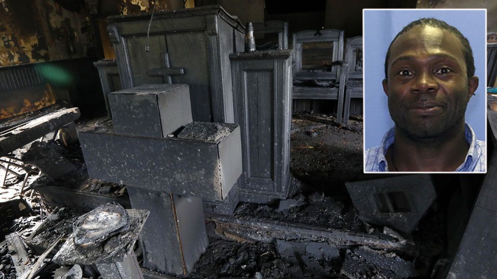 Bishop Clarence Green stands outside his fire-damaged Hopewell Baptist Church in Greenville, Mississippi