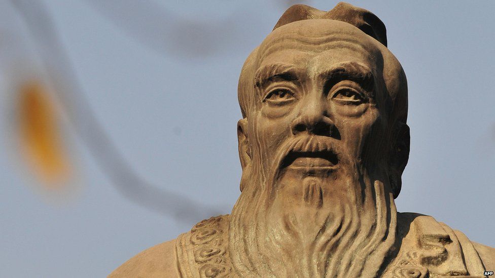 A statue of Confucius, the Chinese philosopher best known for promoting filial piety in the 6th century BC is pictured on the grounds of the Confucius Temple in Beijing on 22 November, 2008