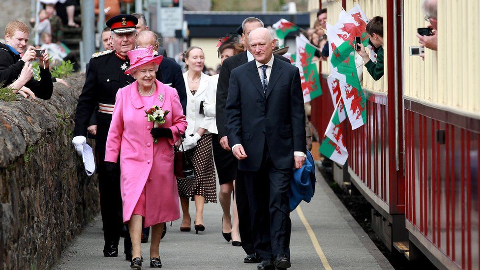 Queen Elizabeth II walks along the platform at Caernarfon steam railway station after visiting the Castle on April 27, 2010 in Caernarfon