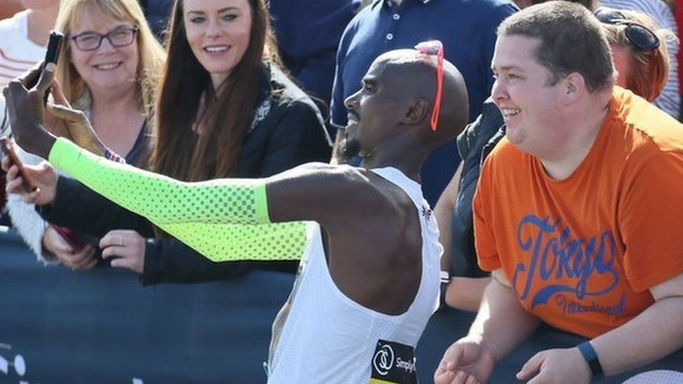 Sir Mo Farah takes a mobile phone selfie after winning the Great North Run