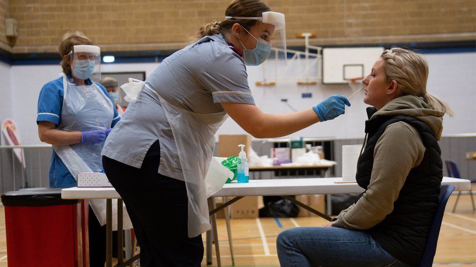 A nurse administers a test on Sarah Key at Dimensions Leisure Centre in Stoke-on-Trent during a testing session held by Stoke-on-Trent City Council using the newly-supplied lateral flow Covid-19 tests. PA Photo. Picture date: Friday November 13, 2020. The tests, which can provide a result within 20 minutes without any lab processing, are being rolled out nationally following earlier successful trials in both Stoke and Liverpool.