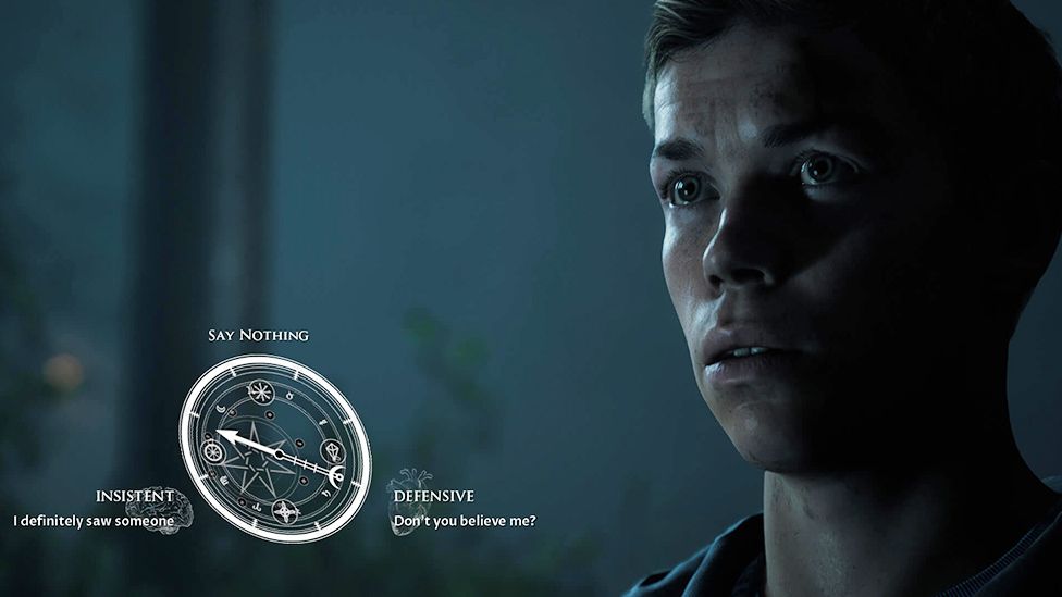 A young man stands in a dark scene - possibly a woodland although it's hard to tell. We see a close-up of his face, barely illuminated by a moonlight-esque glow. He has a pained expression, as if pondering something. To the left of the screen an ornate dial is superimposed on the screen, an arrow on its face can be pointed towards one of three choices. They are: "Say nothing", "Insistent (I definitely saw something," and "Defensive (Don't you believe me?)".