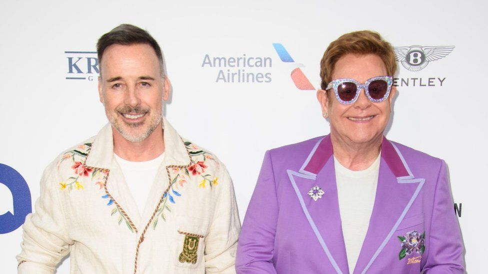 File image of David Furnish and Sir Elton John at an event together