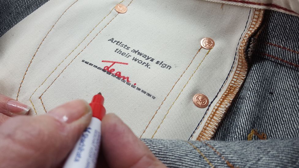 Hiut jeans being signed by the person who made them