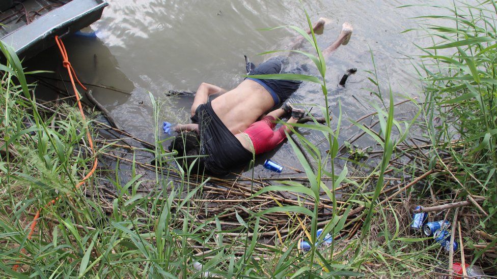 The lifeless bodies of a presumed migrant and his baby lie on a bank of the Rio Grande along the US-Mexico border