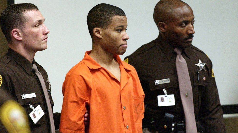Eighteen-year old sniper suspect Lee Malvo, (C), who was 17 at the time of the alleged crimes, appears in court during the trial of sniper suspect John Muhammad in Virginia Beach, Virginia, U.S. on October 22, 2003.