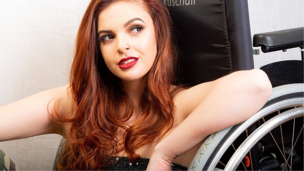 Photo of Ruby Jones in a wheelchair, close up and smiling