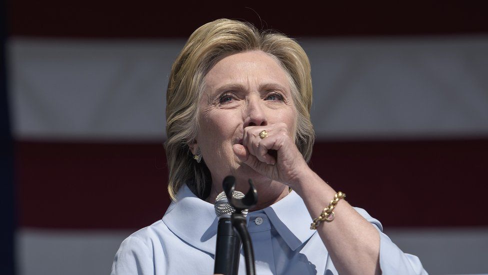 Hillary Clinton coughs during a campaign rally in Cleveland, Ohio, 5 September 2016