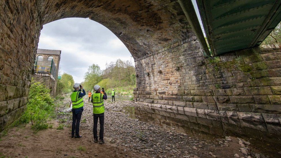 The Coal Authority team insert a sonar device into old mine workings to determine why the bridge is cracking
