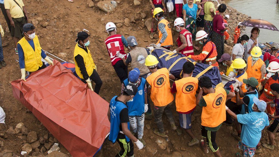 Families of victims join a search and rescue operation following a landslide in Kachin in July 2018