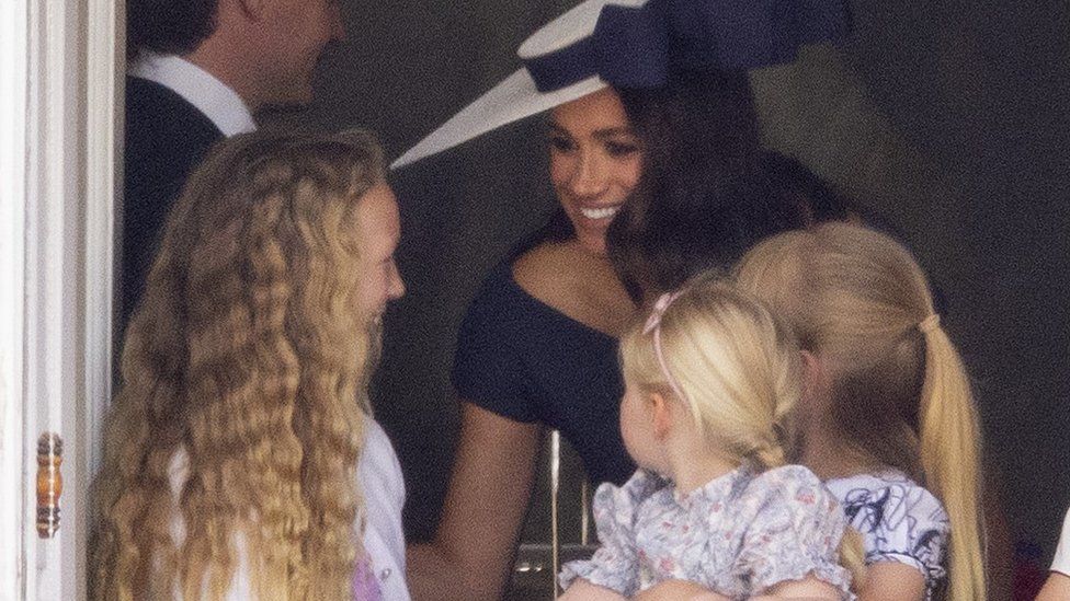 Meghan Markle with Savannah Phillips and Mia Tindall in the Major General's office overlooking Trooping the Colour on Horse Guards Parade