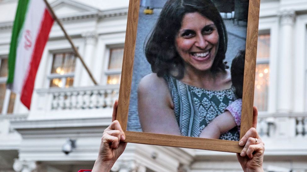 Supporters hold a photo of Nazanin Zaghari-Ratcliffe during a vigil for British-Iranian mother, Nazanin Zaghari-Ratcliffe, imprisoned in Tehran outisde the Iranian Embassy on January 16, 2017