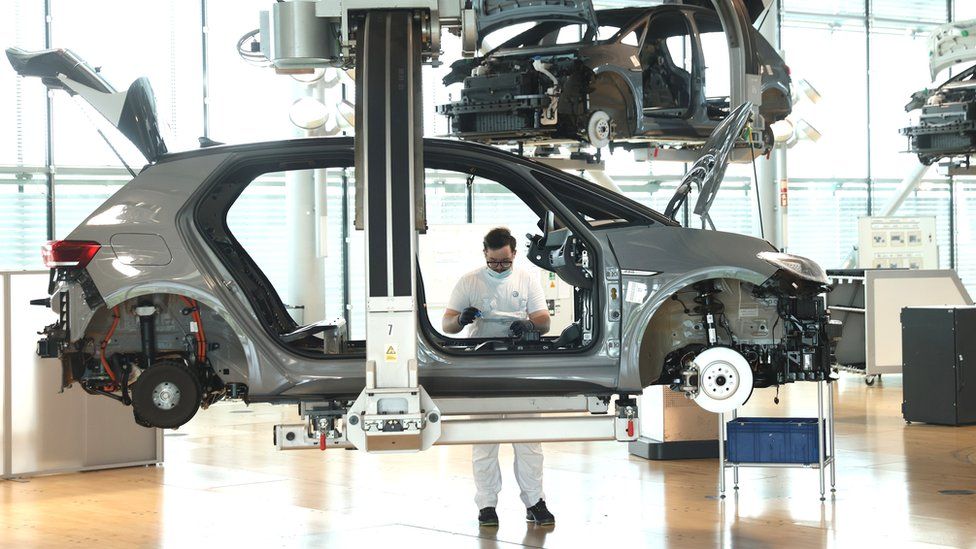 A worker assembles the interior of a Volkswagen ID.3 electric car on the assembly line at the "Gläserne Manufaktur" ("Glass Manufactory") production facility on June 08, 2021 in Dresden, Germany.